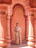 Warm ivory wedding saree with paisley botanical and feather-like border