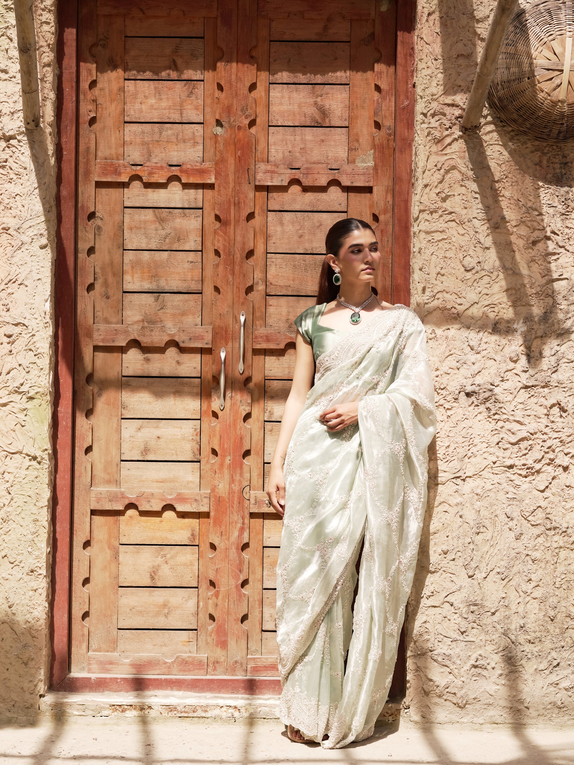 Pearl embroidered mint saree with scalloped paisley border
