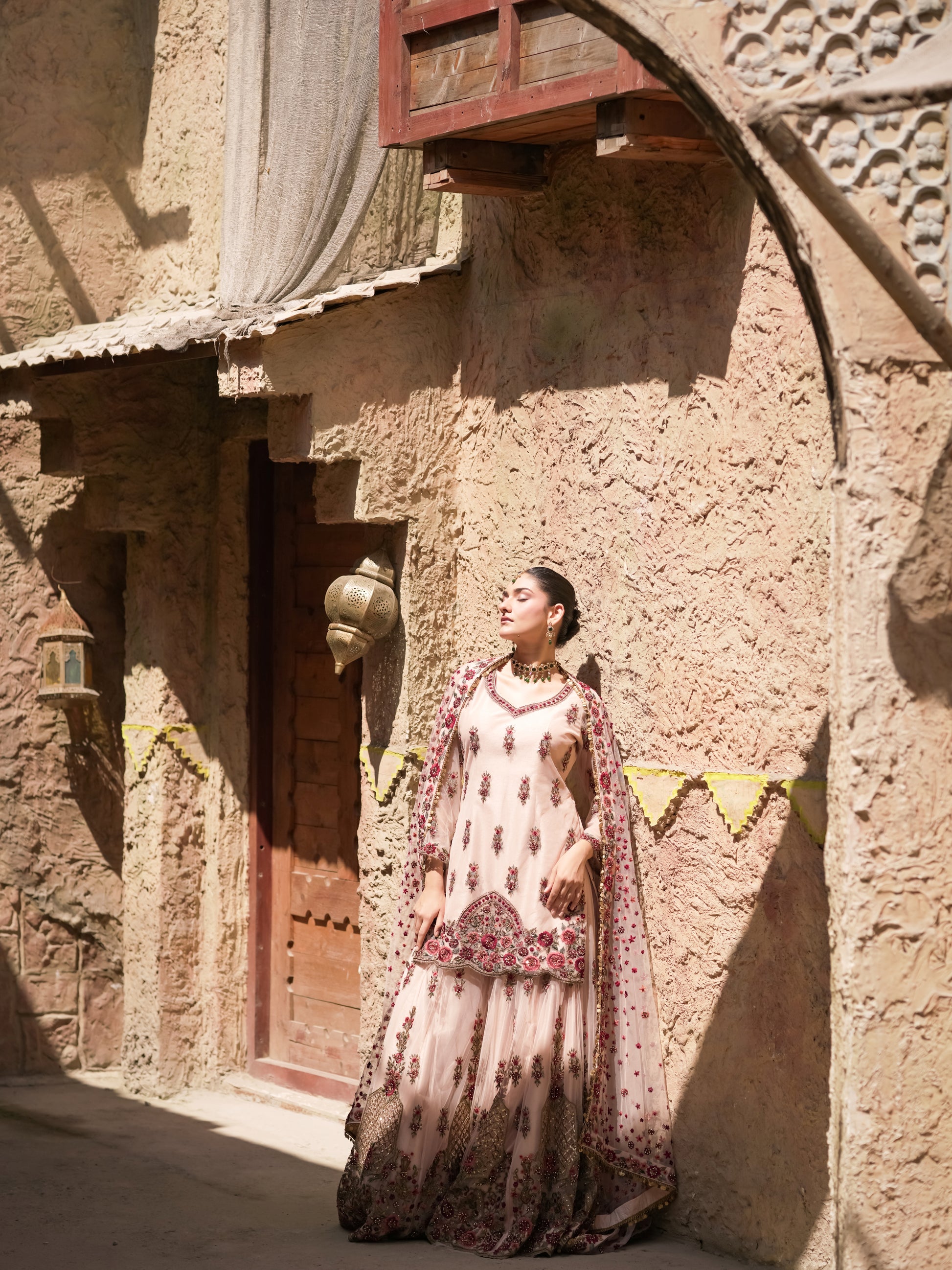 Festive sharara set with wide pants and heavily bordered dupatta