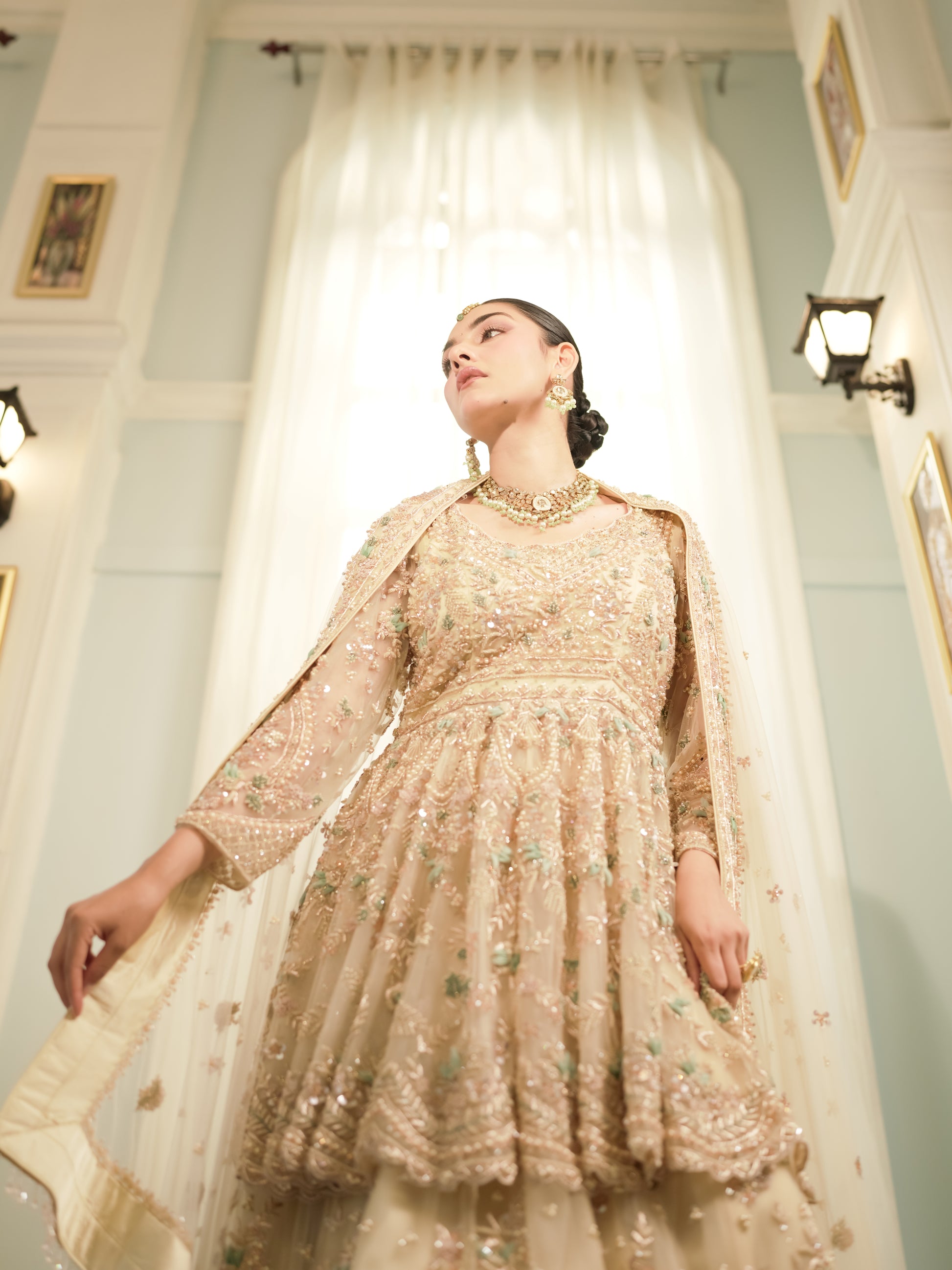 Meher Gul champagne ivory peplum sharara set with mint and blush accents
