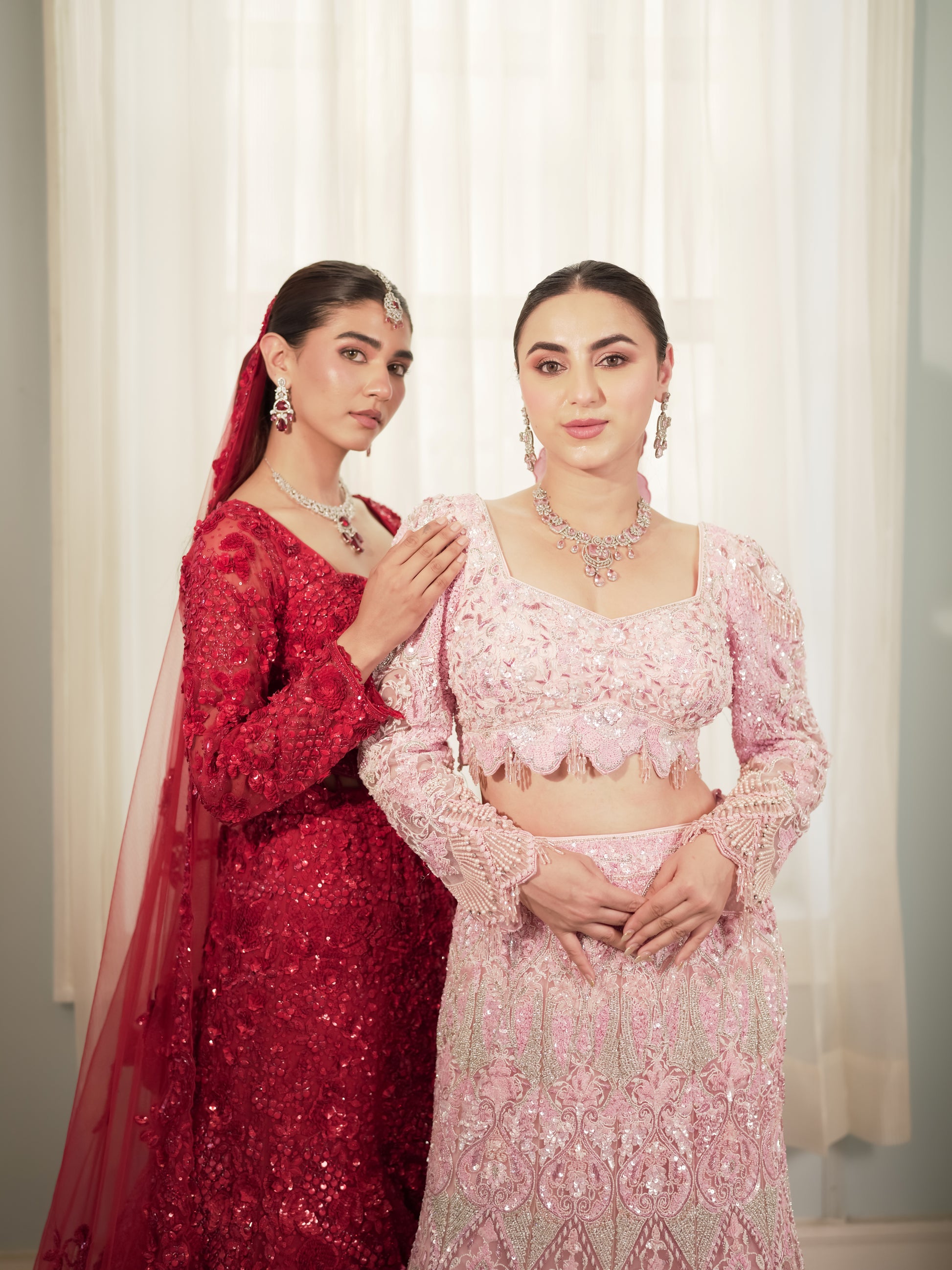 Pink wedding lehenga with sculpted fishtail silhouette and floral embroidery