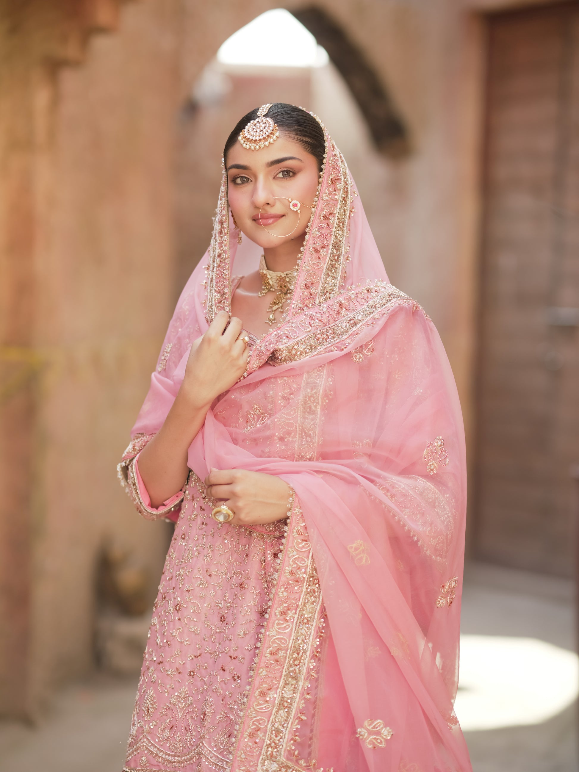 Pink wedding sharara with wide-flare pants and knee-length kurta