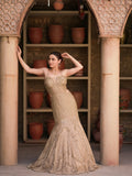 Champagne gold couture fishtail gown with sculpted corset and trailing hem