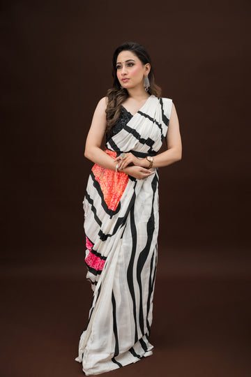 White & Black Striped Saree with Pink-Orange Border – Monotone Sequin Blouse
