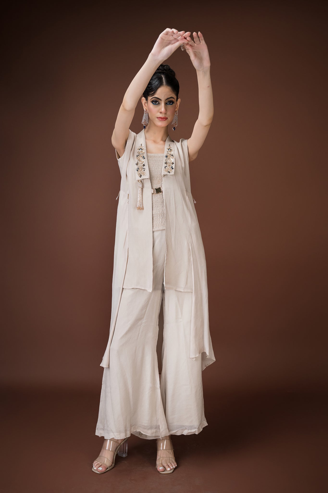 Ivory straight-cut palazzo with mocked blouse, and an open longline jacket.