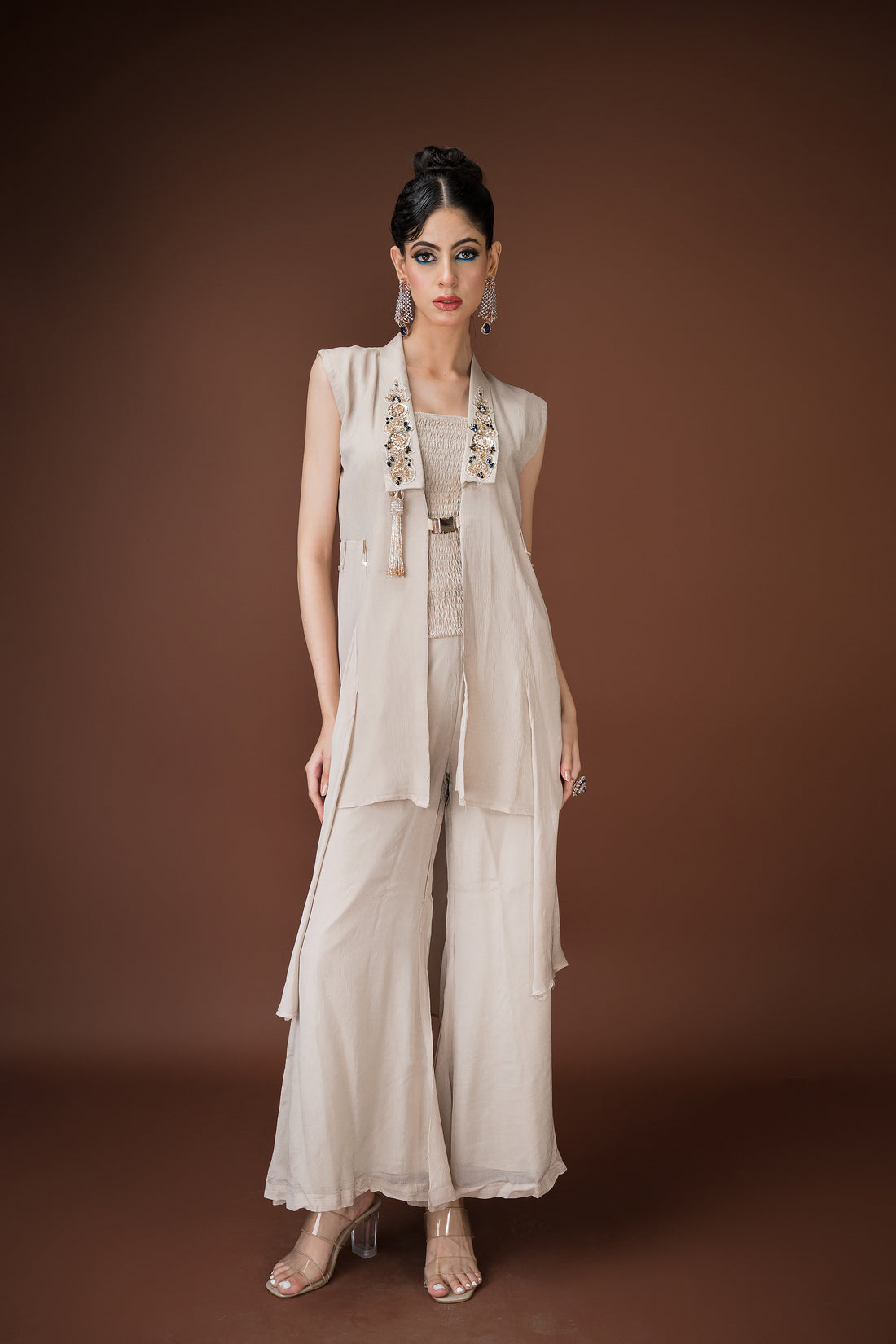 Ivory straight-cut palazzo with mocked blouse, and an open longline jacket.