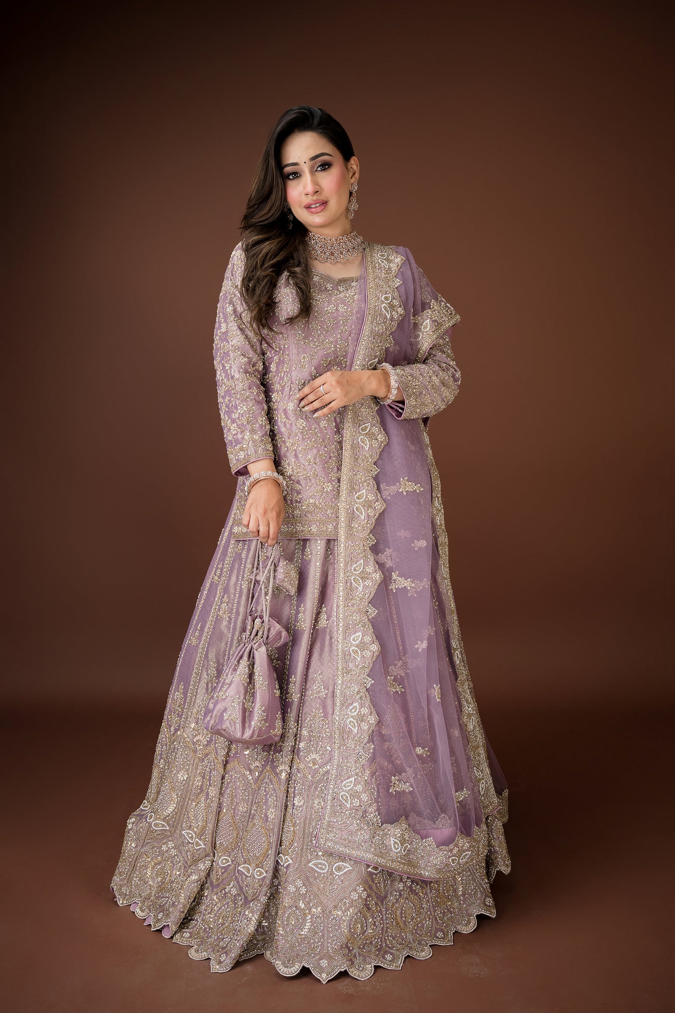 Mauve lehenga with high-neck kurti-style blouse and paired with full sleeves